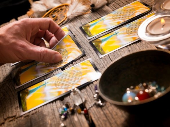 Fortune teller holding a tarot card